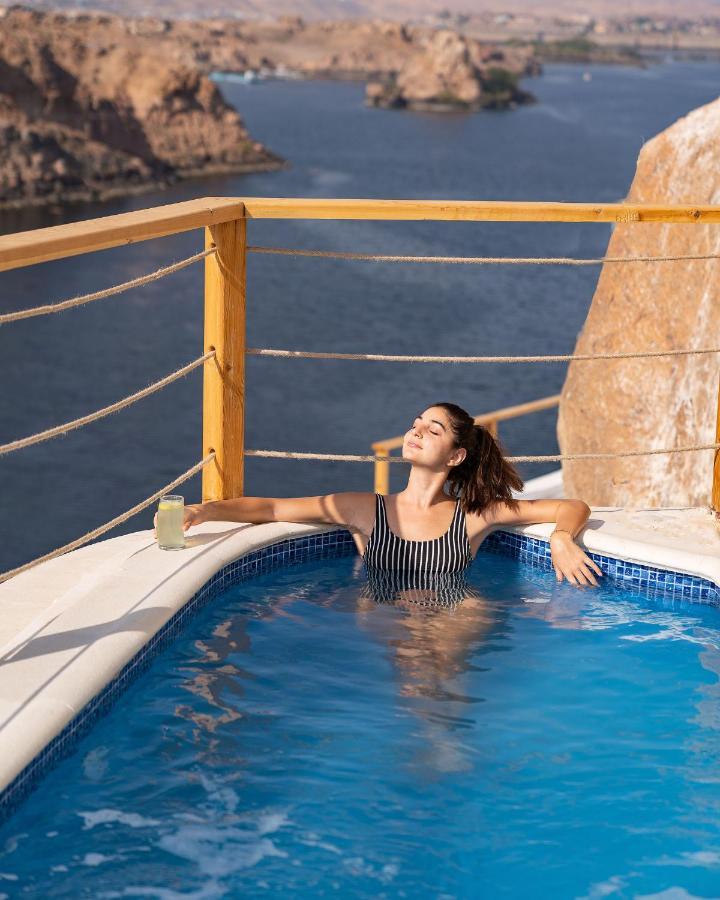 Benben By Dhara Hotels - Adults Only Aswan Exteriör bild A woman relaxing in a swimming pool